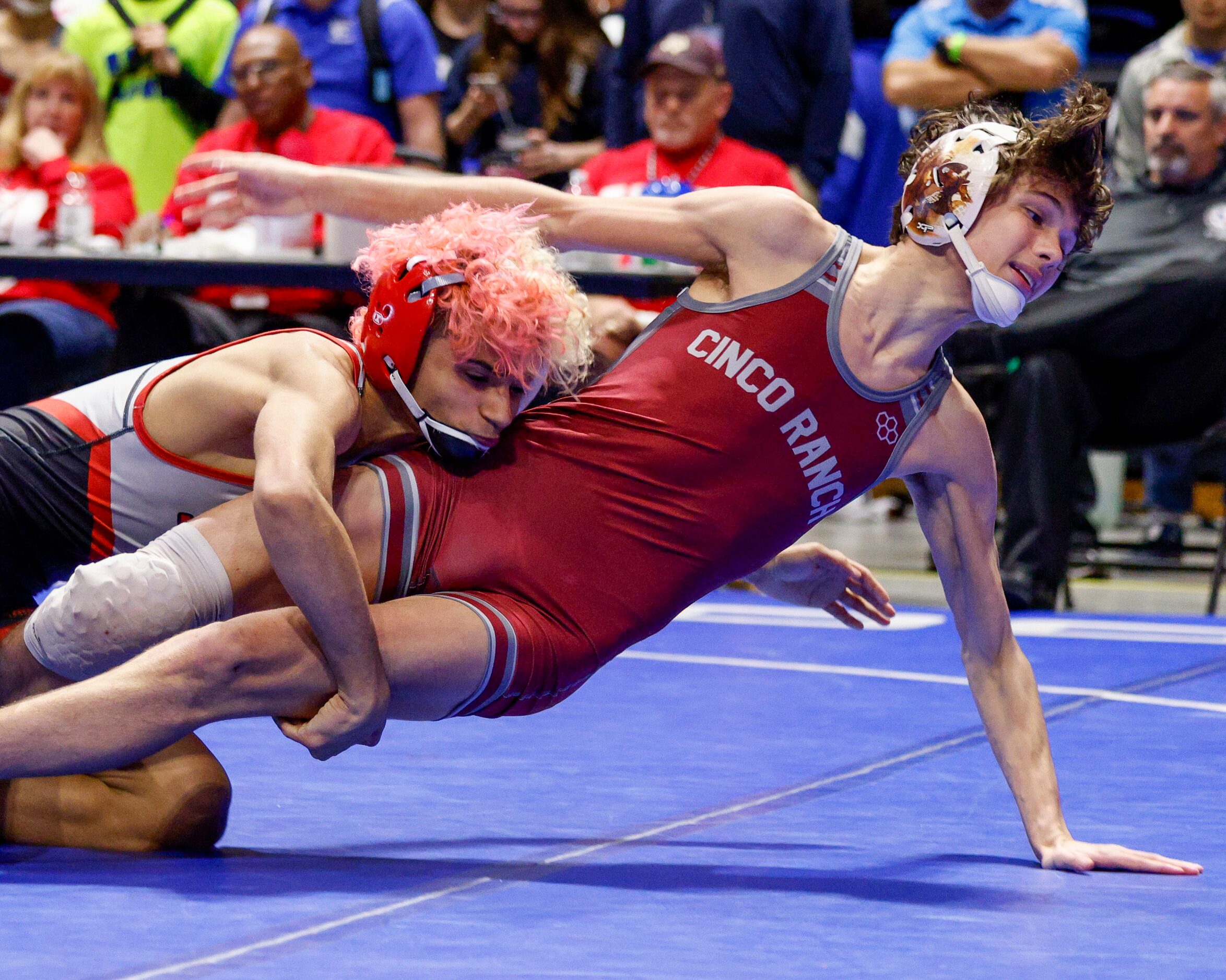 Shawn Ryncarz of Arlington Martin (left) wrestles Jackson Herman of Katy Cinco Ranch during...