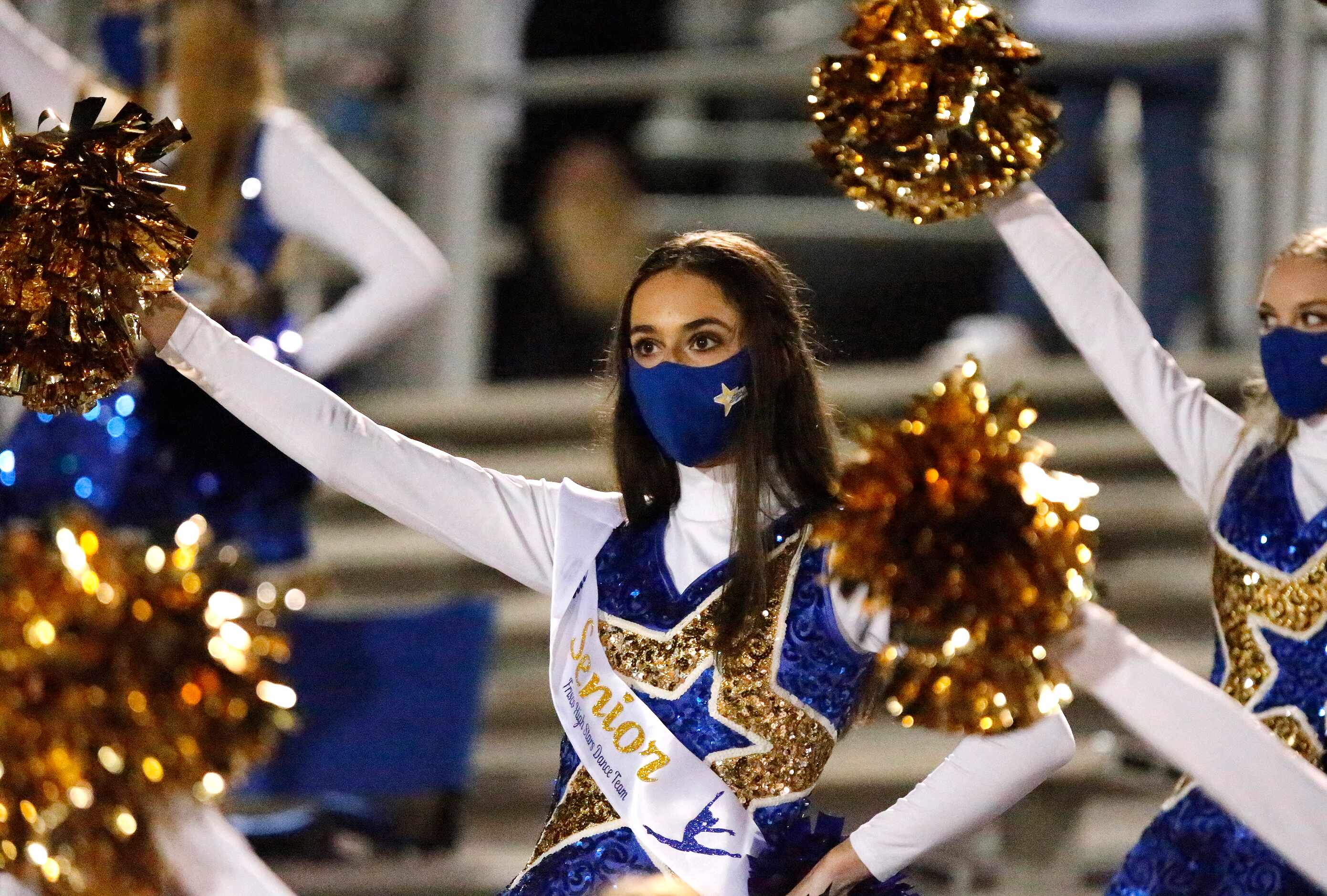 The Frisco High School Stars drill team perform in the stands before kickoff as Frisco High...