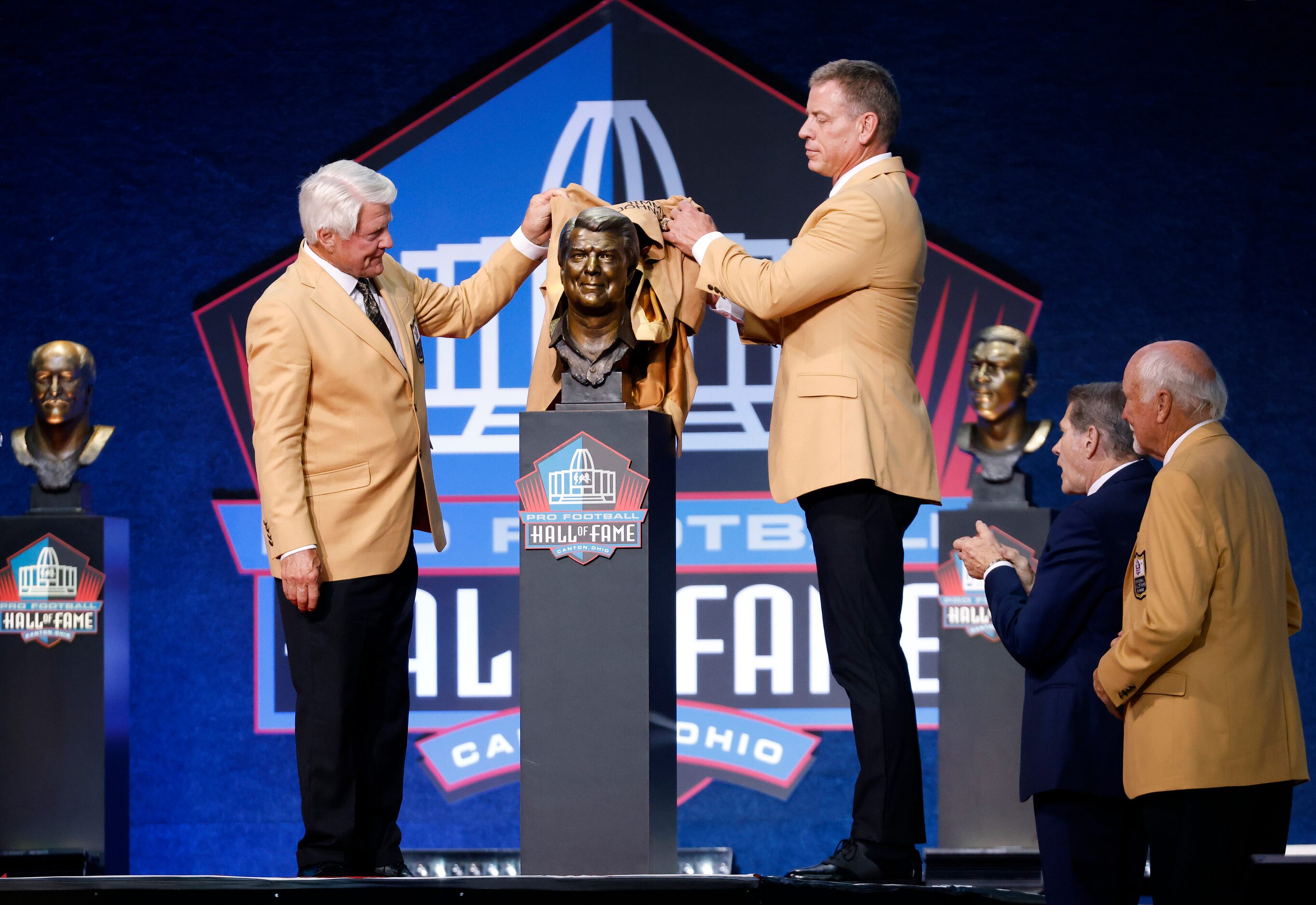 Pro Football Hall of Fame inductee Jimmy Johnson of the Dallas Cowboys (left) unveils his...