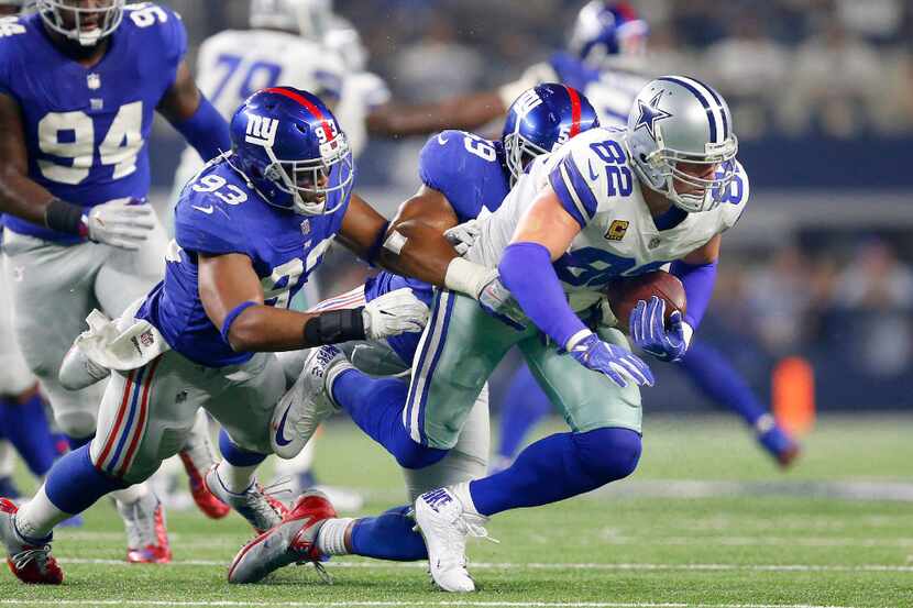 Dallas Cowboys tight end Jason Witten (82) makes a second quarter reception as he is tackled...