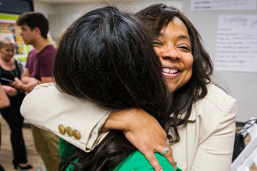 Lavinia Masters hugs Rep. Victoria Neave after Gov. Greg Abbott signed House Bill 8 during a...
