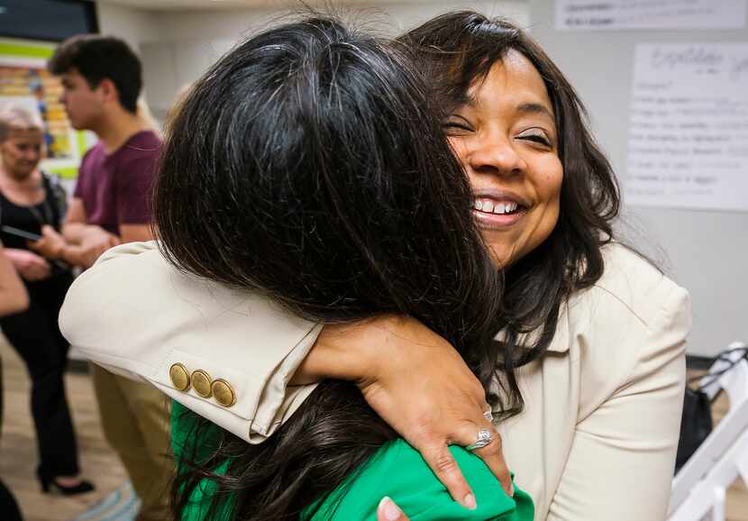 Lavinia Masters hugs Rep. Victoria Neave after Gov. Greg Abbott signed House Bill 8 during a...