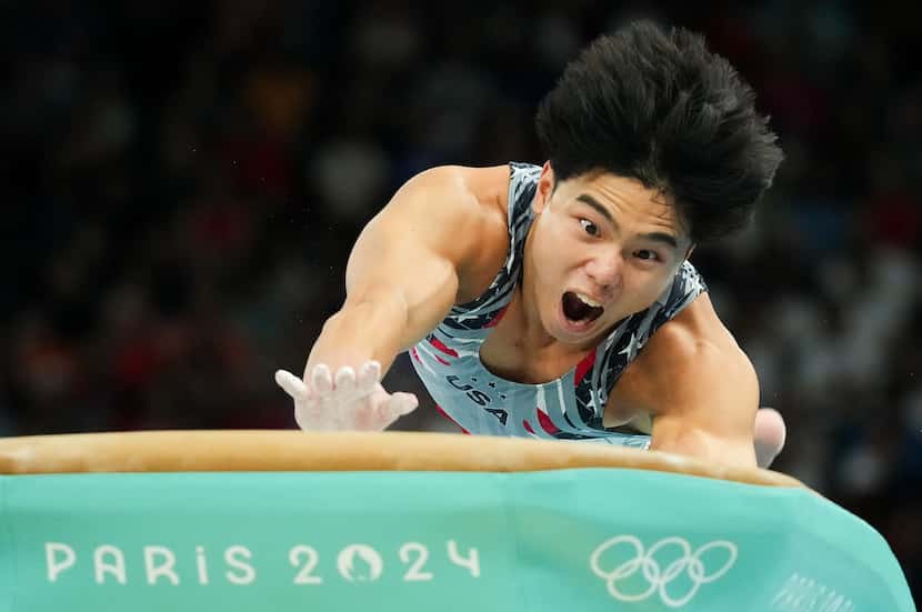 Asher Hong of the United States compete on the vault during the men’s gymnastics team final...