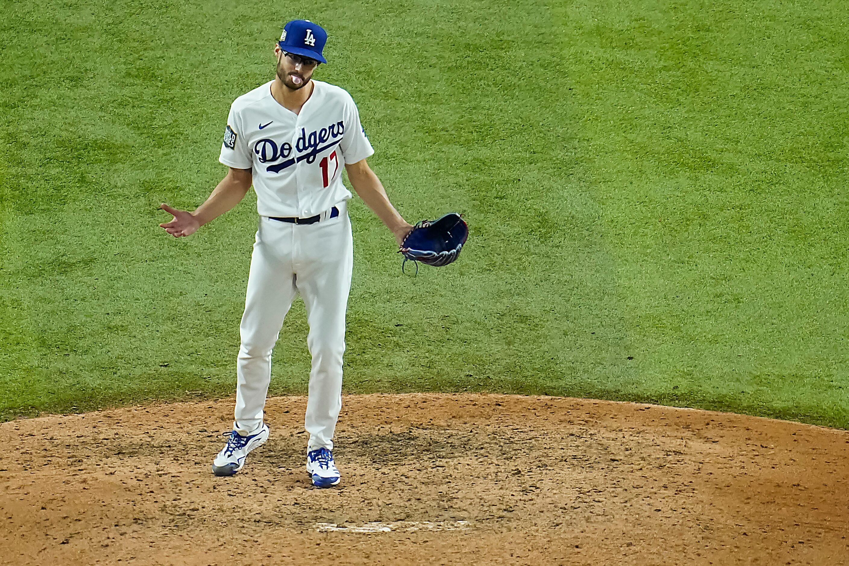 Los Angeles Dodgers relief pitcher Joe Kelly reacts to the final out of a 8-3 victory over...