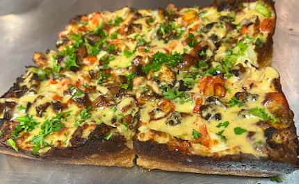 "The Dak" is a specialty pizza at Motor City in Lewisville that comes topped with jambalaya:...