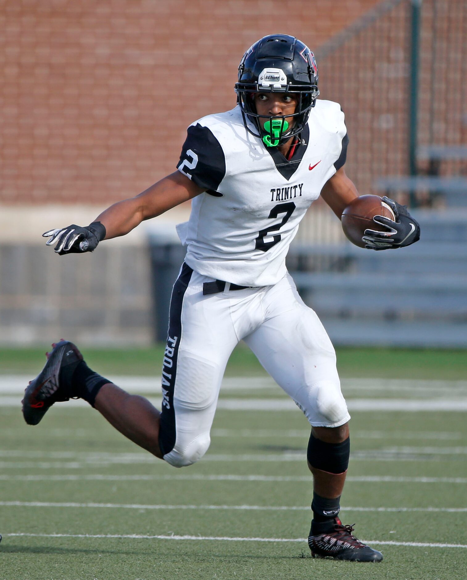 Euless Trinity running back Ollie Gordon (2) runs against Haltom during their District 3-6...