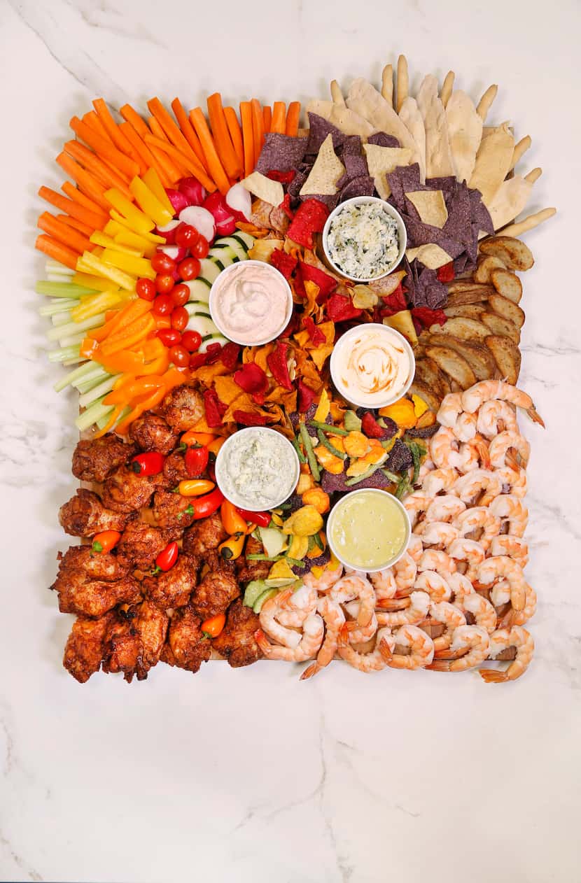 A frycuterie board features dipping vessels and dips (from top to bottom) Houston’s...