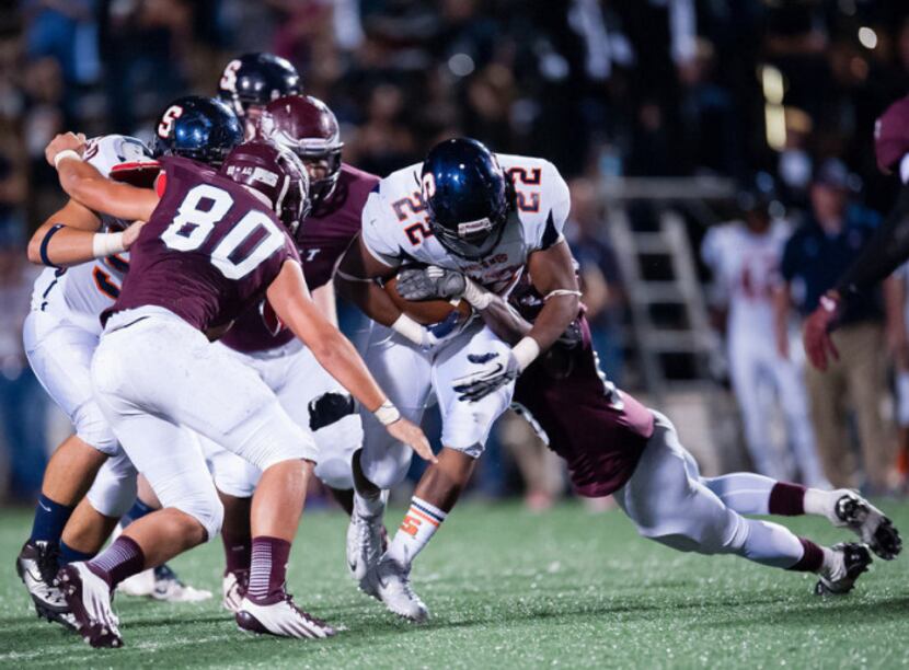 Sachse running back Devine Ozigbo carries the ball in Sachse's 57-31 win over Rowlett on...