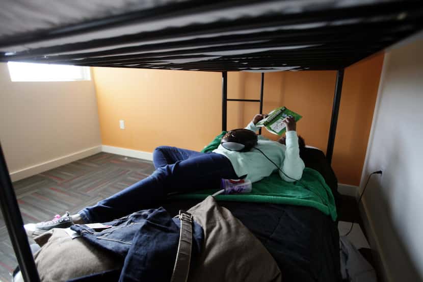 A 13-year-old girl relaxes at Promise House, a Dallas nonprofit that helps homeless, runaway...