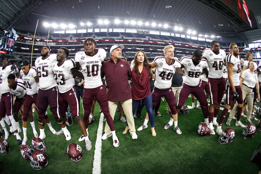 Texas A&M head coach Jimbo Fisher celebrates with his team after defeating Arkansas in an...