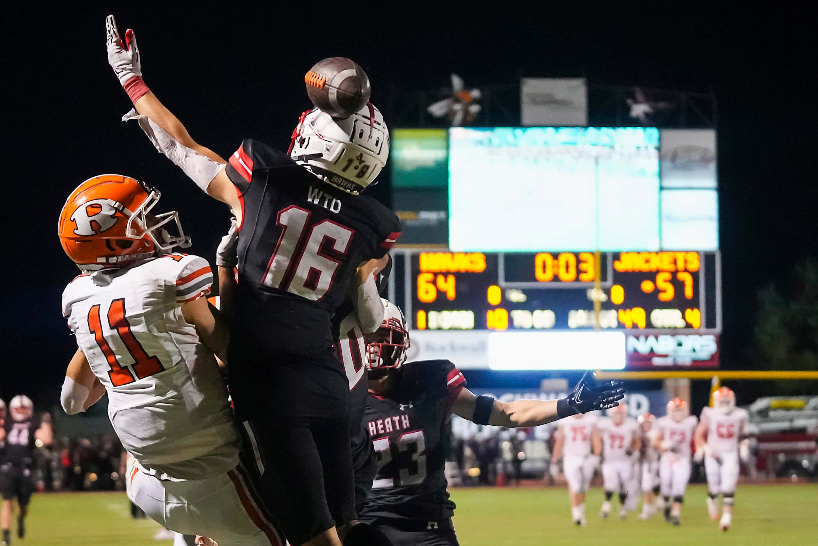 Rockwall wide receiver Caden Marshall (11) and Rockwall-Heath defensive back Brady Luff (16)...