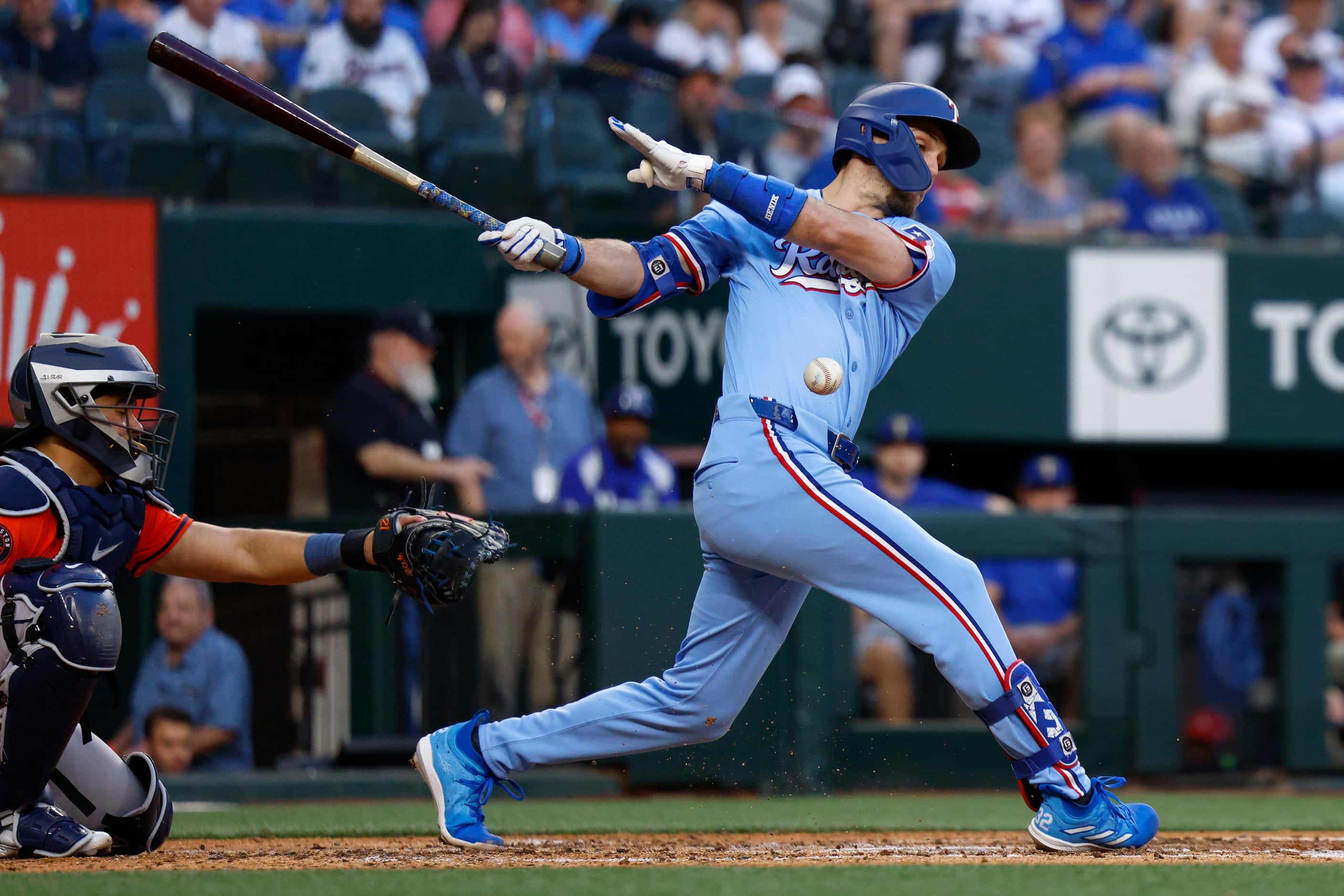 Texas Rangers left fielder Evan Carter (32) fouls a ball off during the fourth inning...