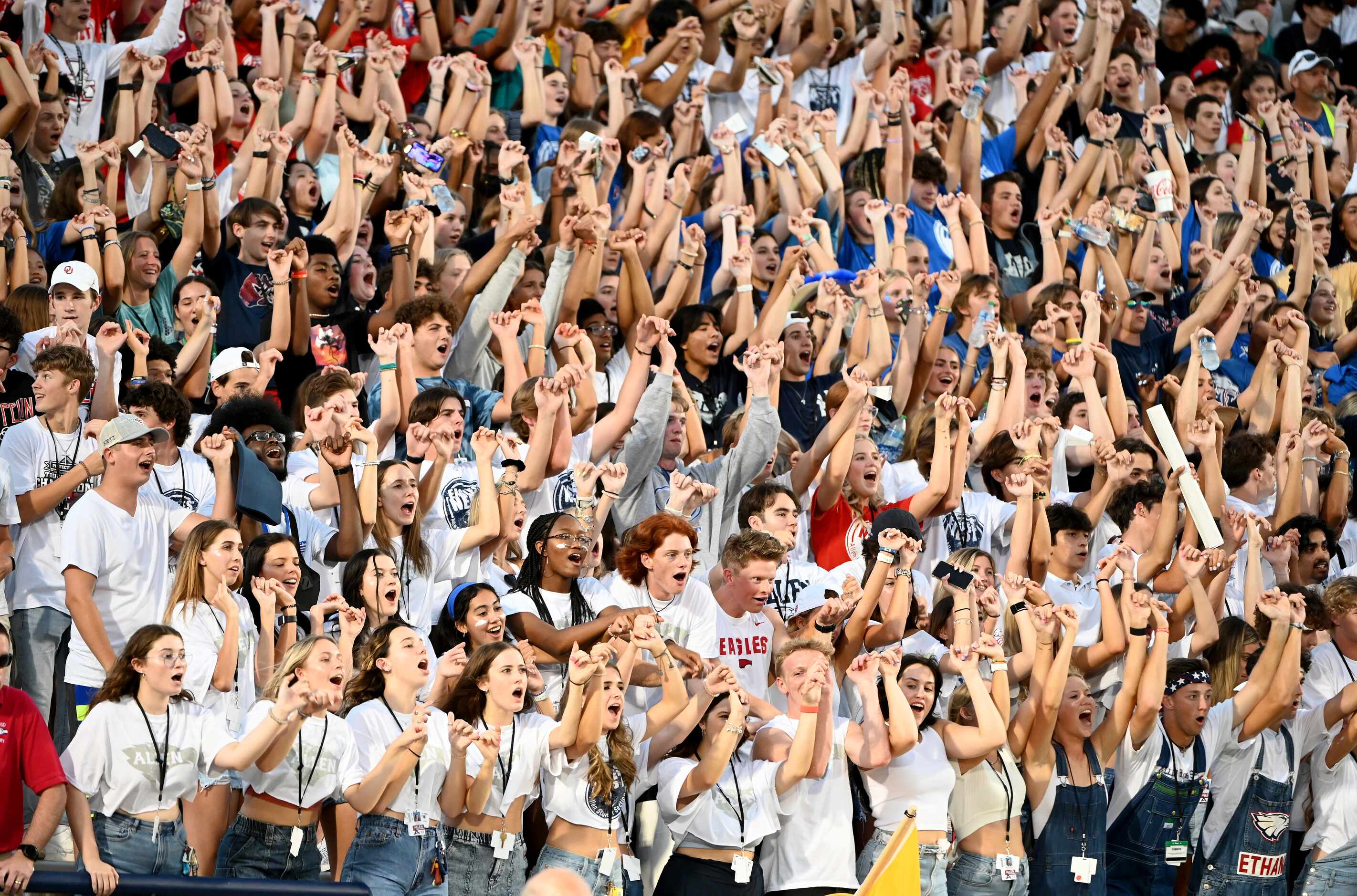 The Allen student section cheer in the first half during a high school football game between...