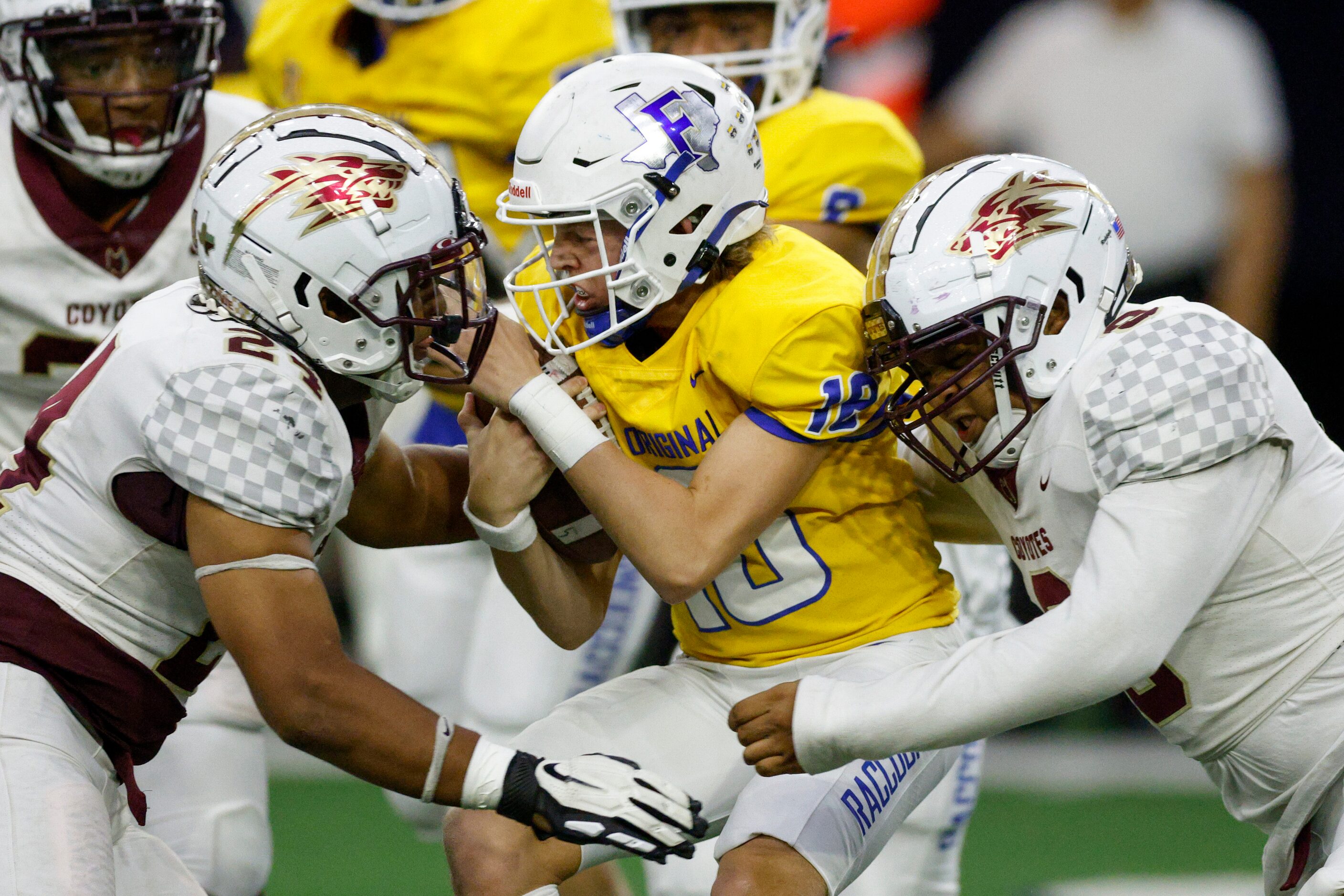 Frisco Heritage linebacker Diego Gonzalez (24) and defensive lineman Dominic Nolan (9) sack...