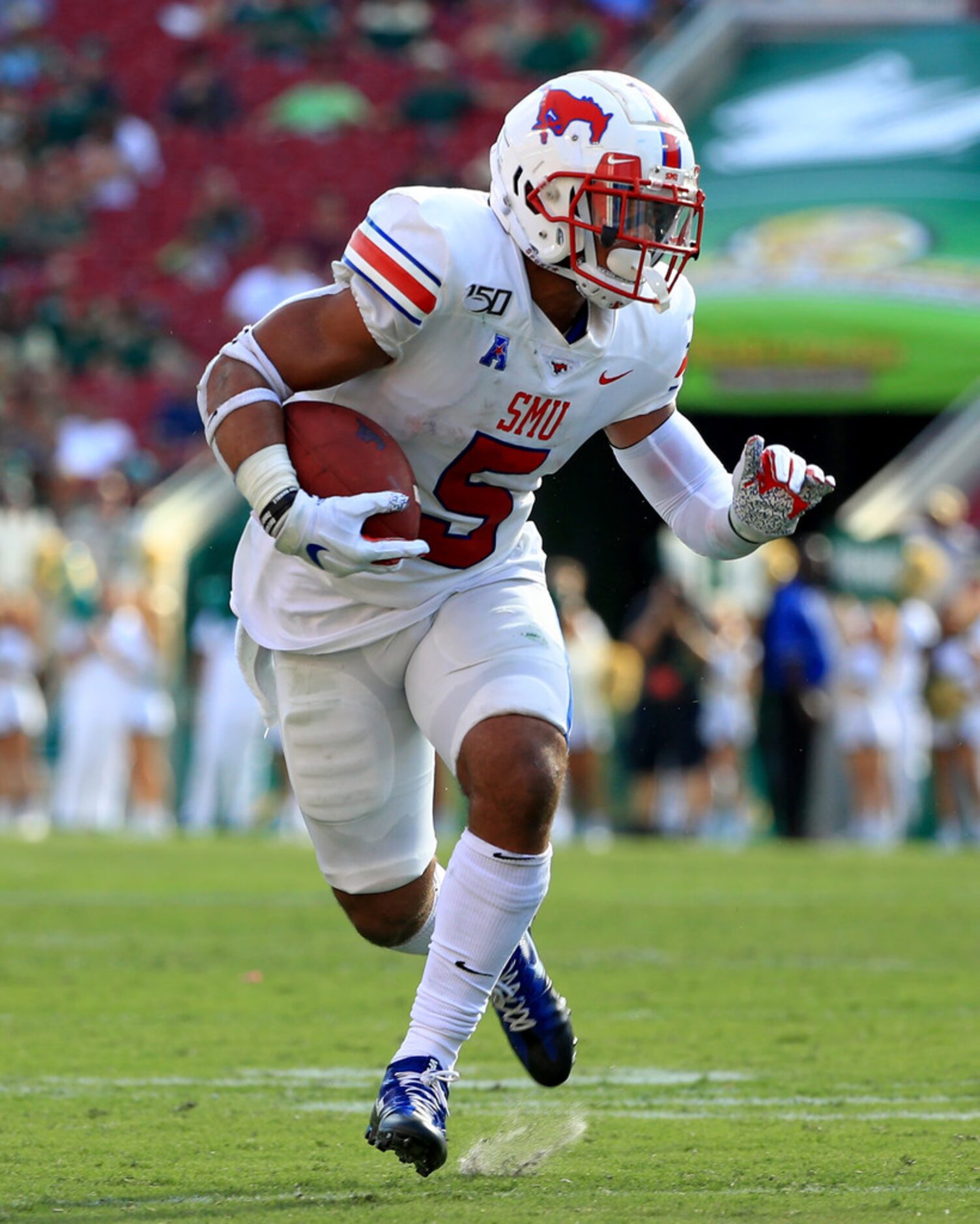 TAMPA, FLORIDA - SEPTEMBER 28: Xavier Jones #5 of the Southern Methodist Mustangs rushes...