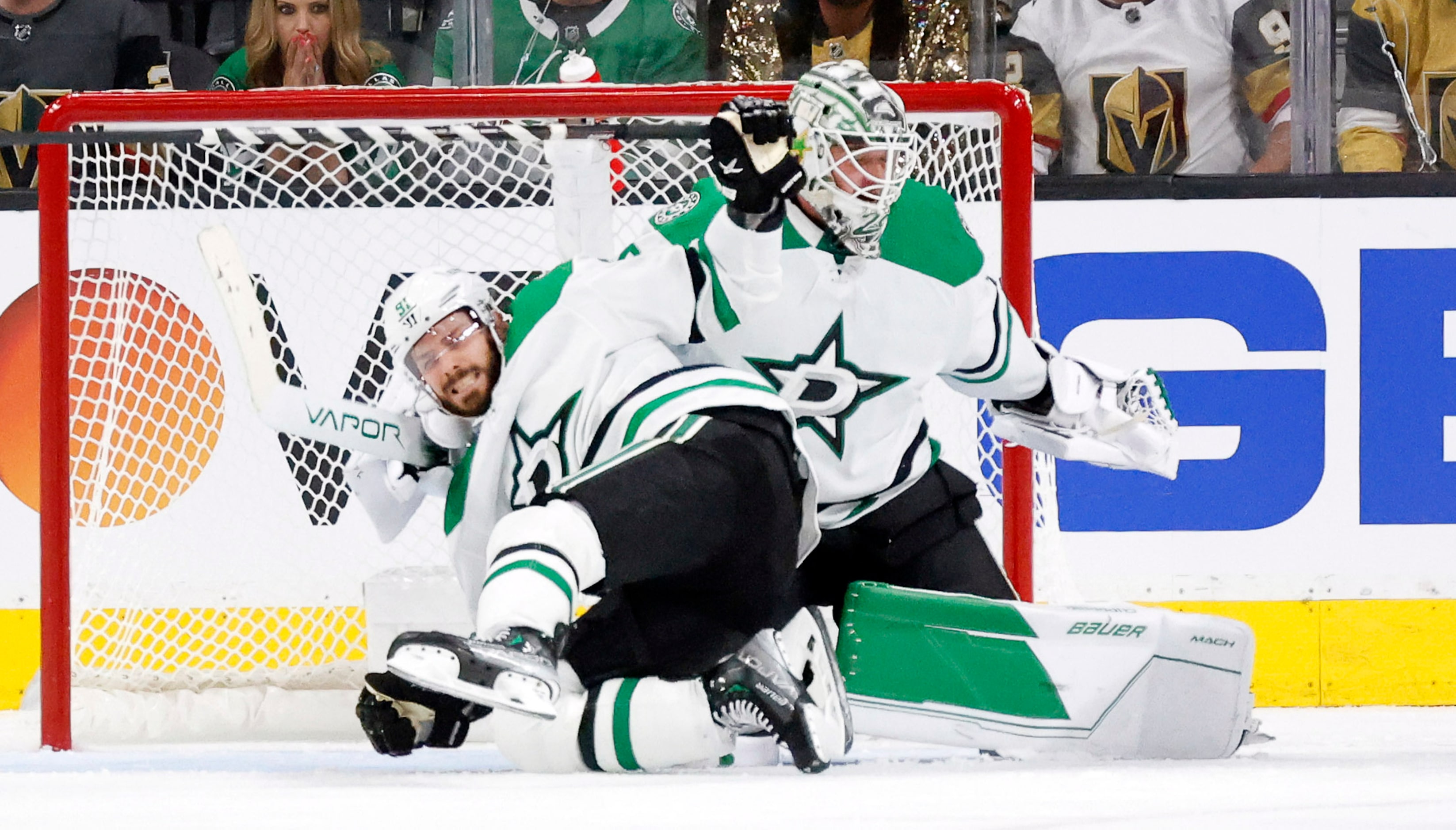 Dallas Stars center Tyler Seguin (91) loses his balance and fall into goaltender Jake...