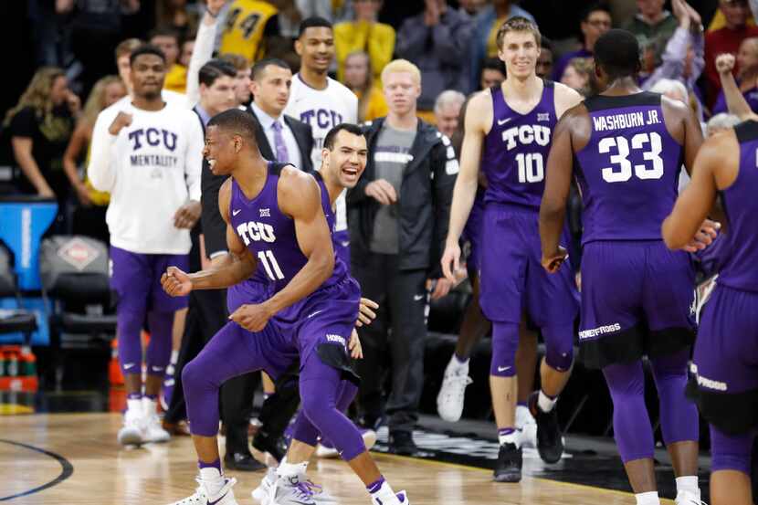 TCU guard Brandon Parrish (11) celebrates with teammate Michael Williams at the end of a...