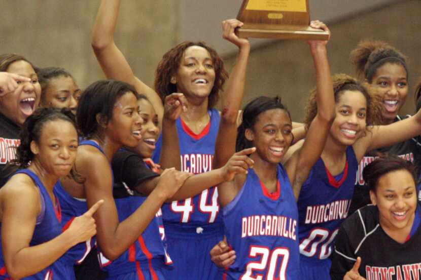 The Duncanville girls basketball team celebrate their victory over Irving MacArthur to...