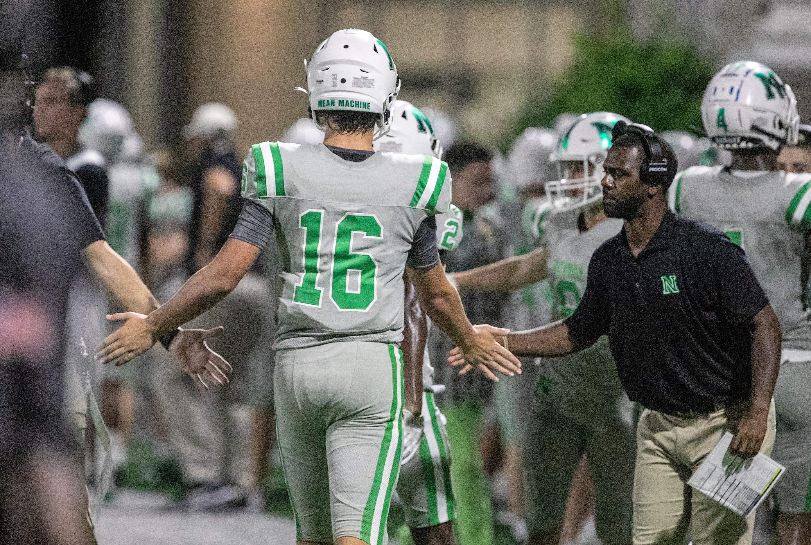 Arch Manning is congratulated by coaches after another touchdown pass as Newman High School...