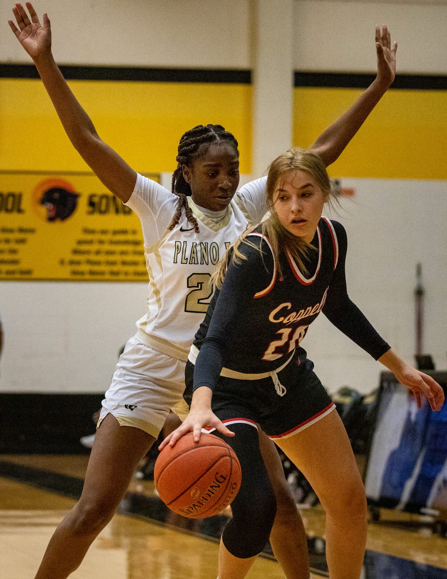 Plano East High School Ada Anamekwe (25) blocks Coppell High School Julianna Lamendola (20)...