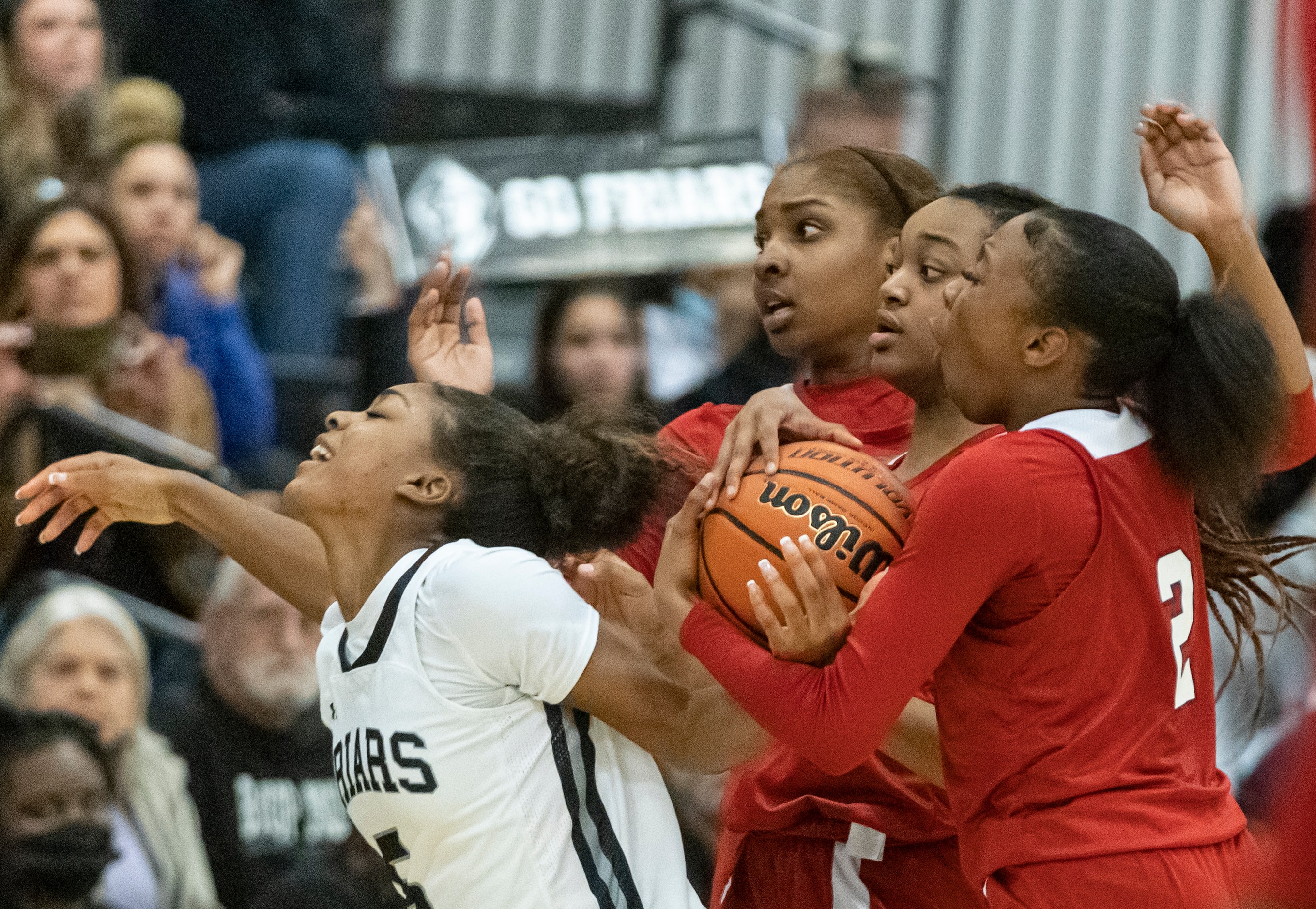 Bishop Lynch High School Maddie Cockrell (5) is pushed away from the ball as she is...