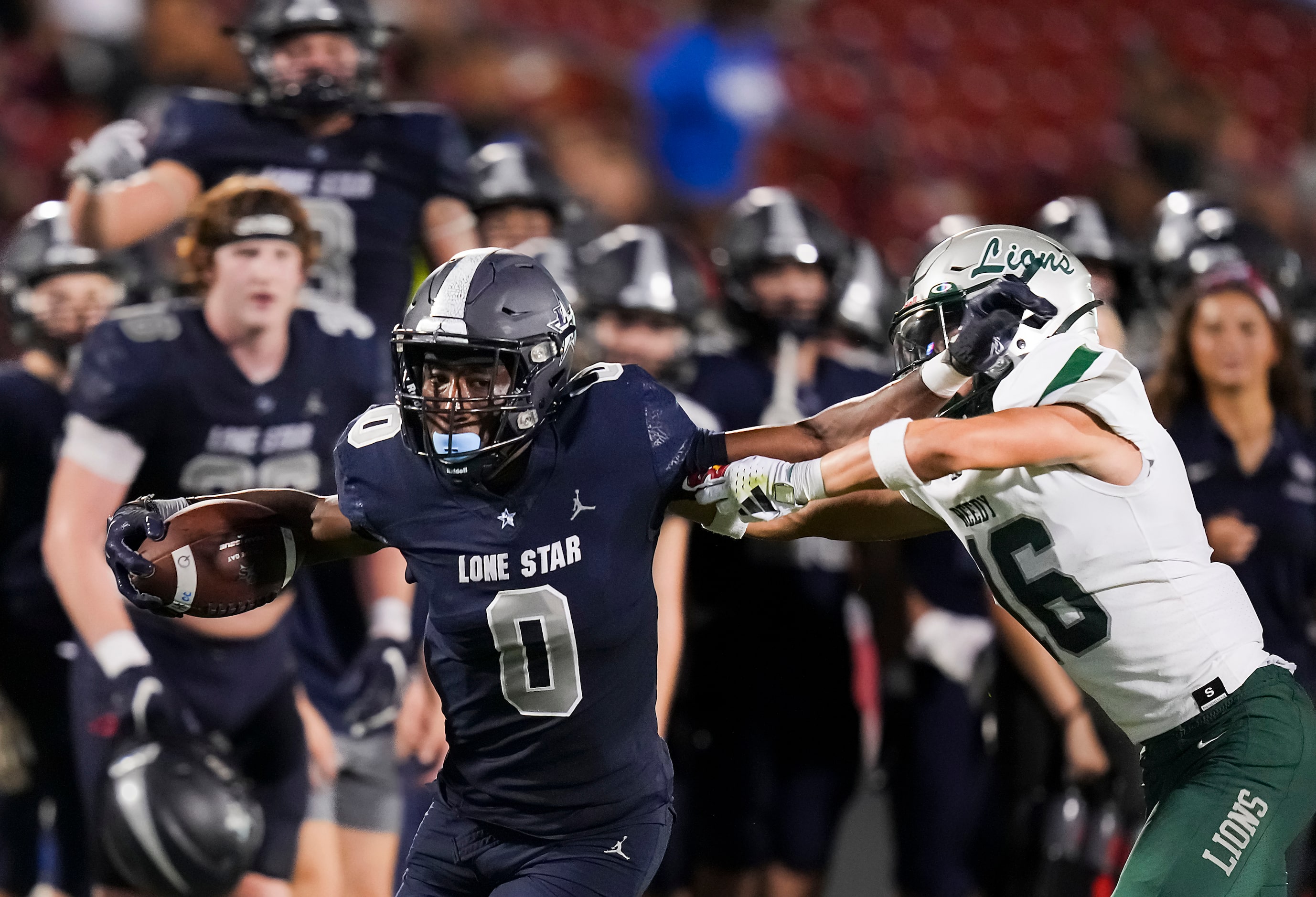 Frisco Lone Star running back Davian Groce (0) gets past Frisco Reedy defensive back Josiah...