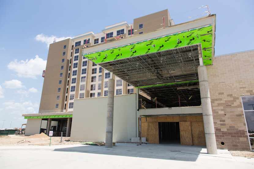 Construction crews work on finishing Denton's first hotel and convention center in July. An...