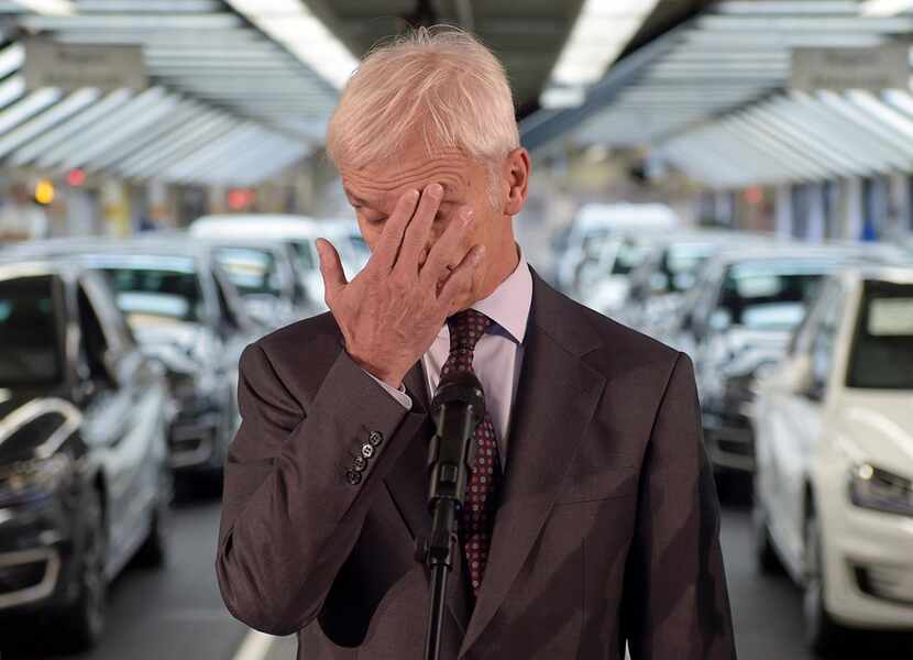 
Matthias Mueller, CEO of German car maker Volkswagen, gestures while addressing journalists...