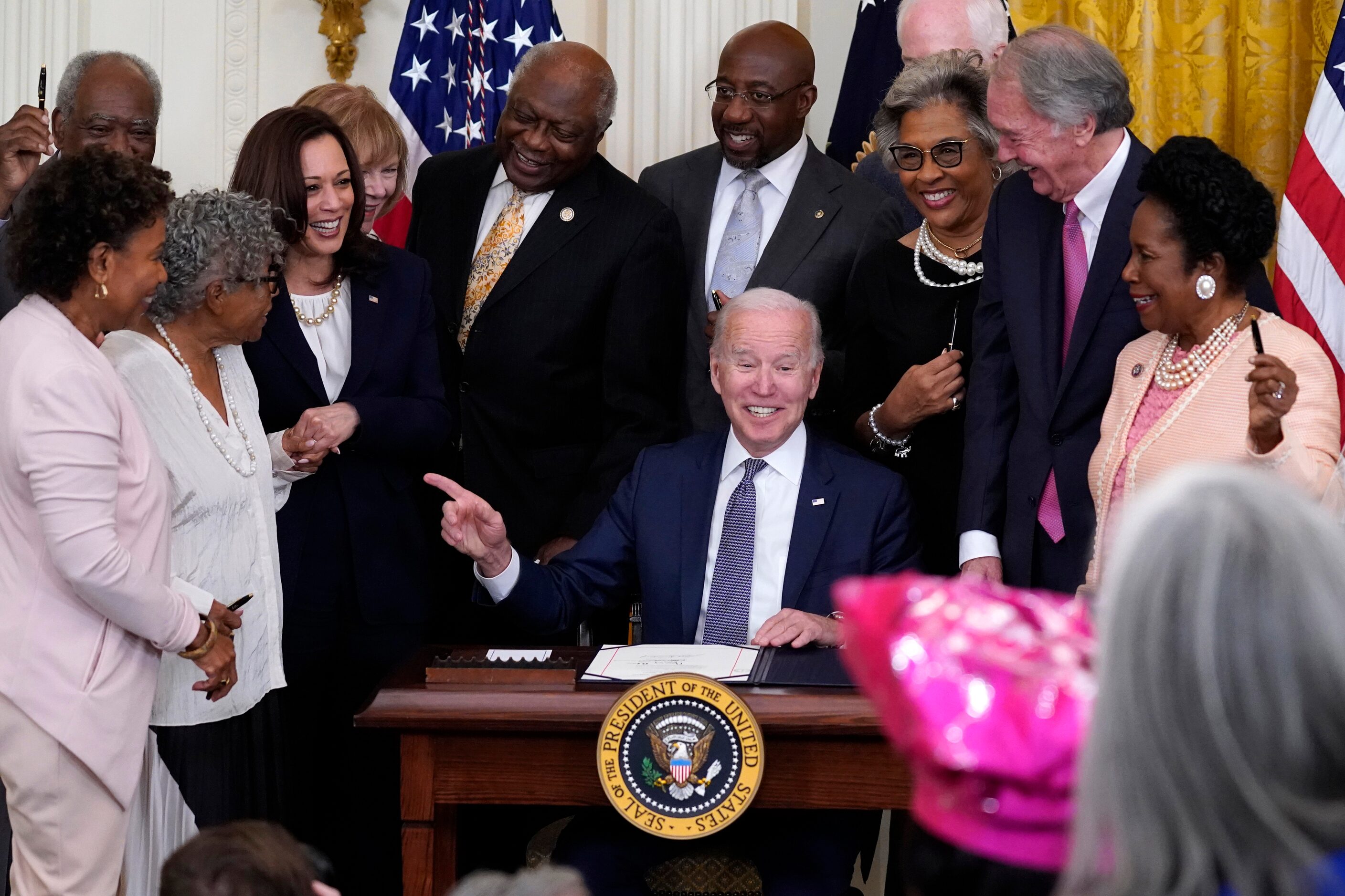 President Joe Biden points to Opal Lee after signing the Juneteenth National Independence...