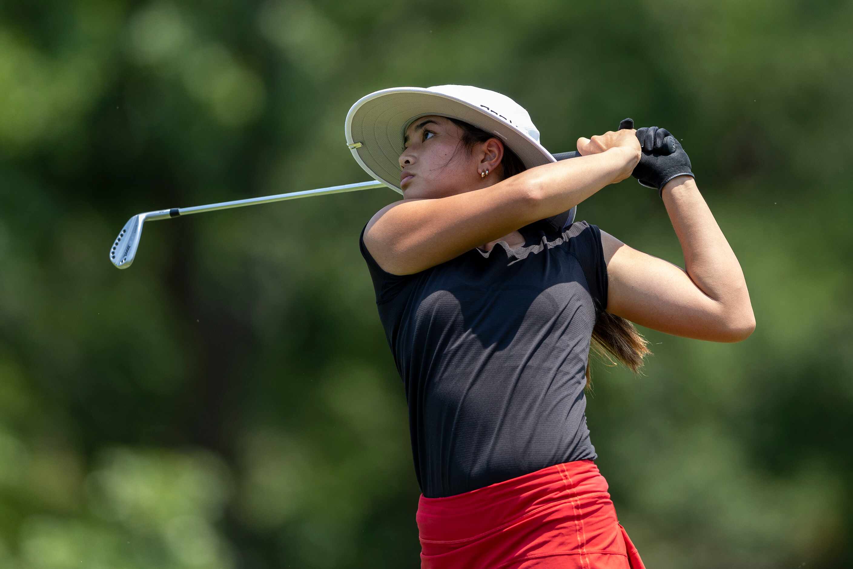 Coppell’s Kristin Angosta hits from the 8th tee box during the 6A girls state golf...