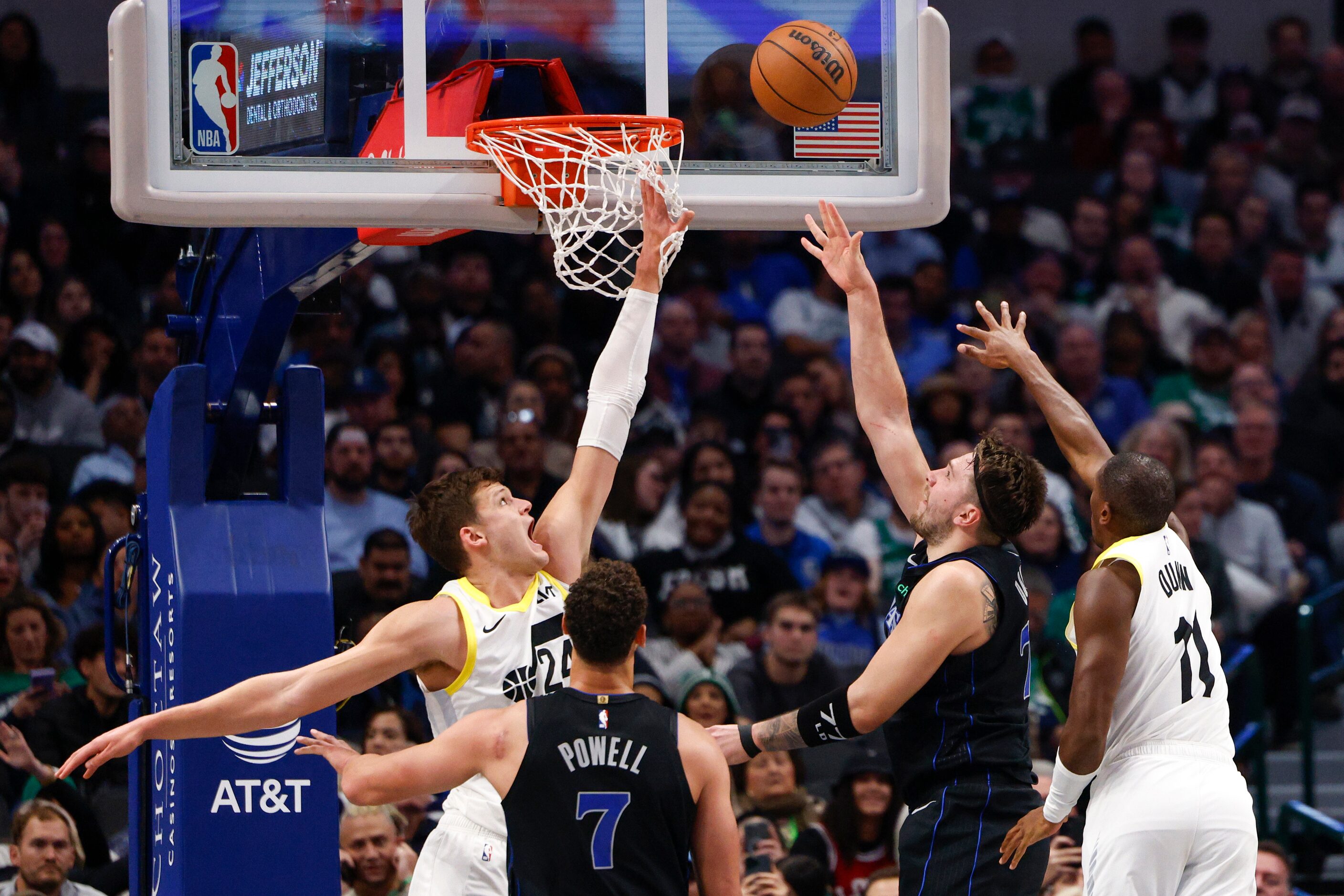 Dallas Mavericks guard Luka Doncic (77) attempts a layup against Utah Jazz center Walker...