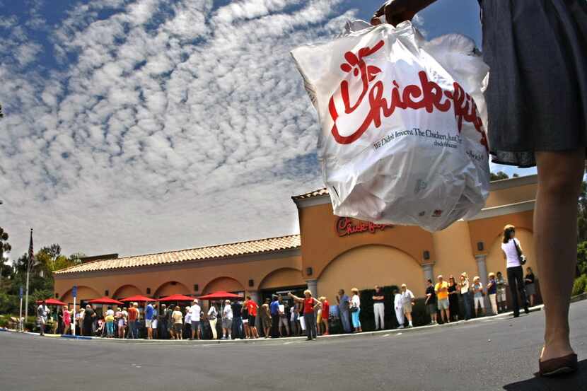 Hundreds of customers line up at a Chick-fil-A in California in 2012. Franchise owners...