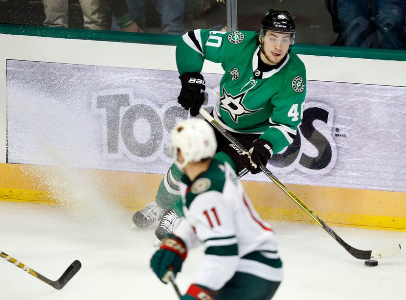 Dallas Stars left wing Remi Elie (40) puts on the brakes as he looks to pass against the...