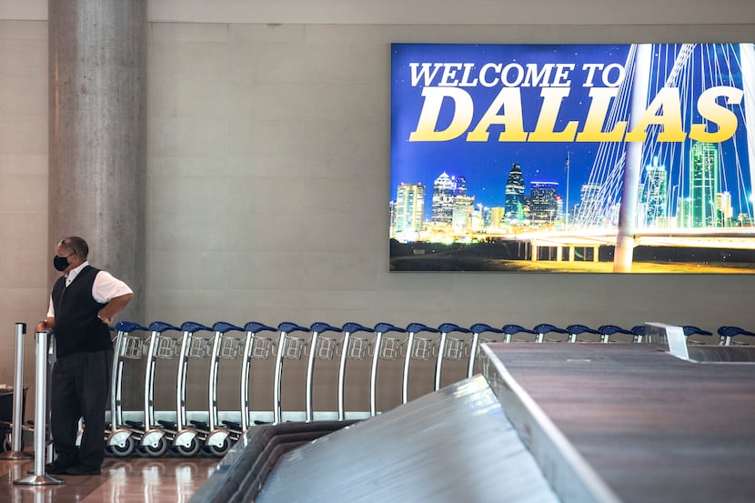 CF Wimbish, who manages luggage carts and ground transportation services, stands in a nearly...