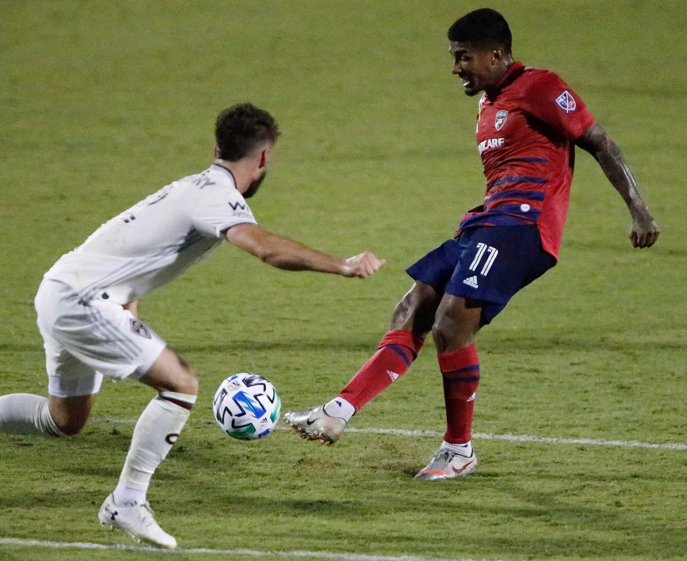 FC Dallas midfielder Santiago Mosquera (11) takes a shot on goal as Colorado Rapids defender...