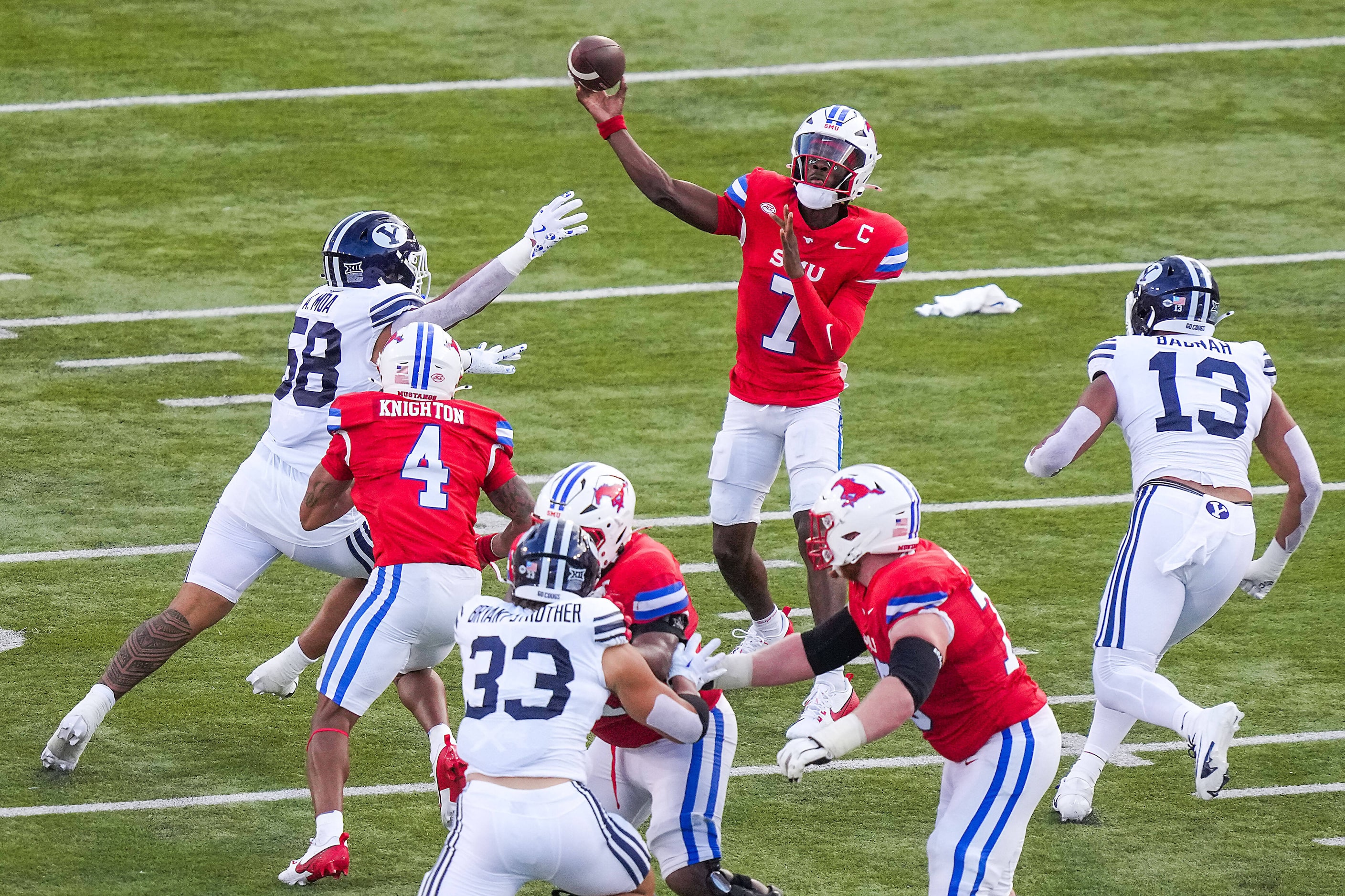 SMU quarterback Kevin Jennings (7) throws a pass during the first half of an NCAA football...