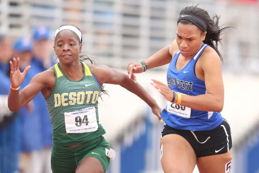 DeSoto sprinter Jada Laye edges Cecily Edwards of Plano West at the finish line for the...
