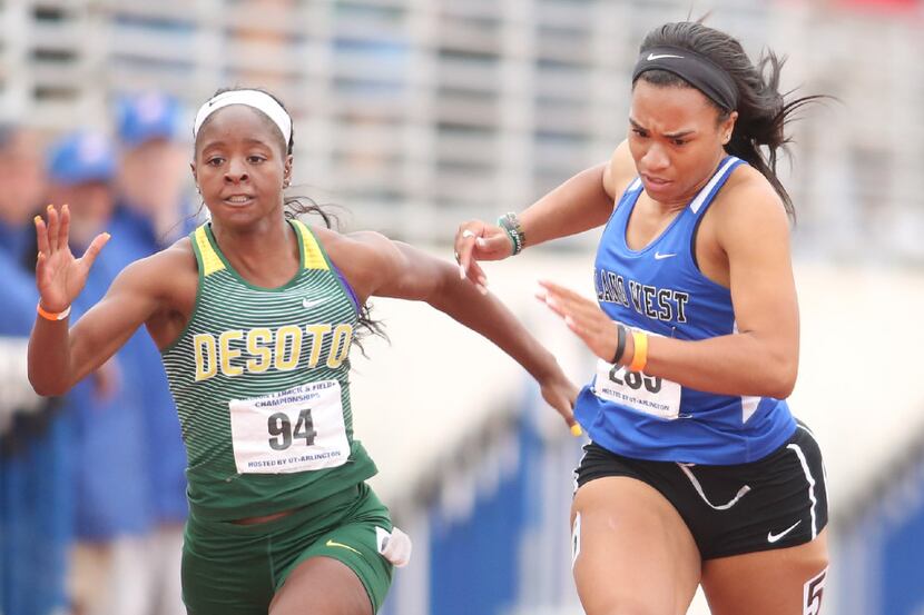 DeSoto sprinter Jada Laye edges Cecily Edwards of Plano West at the finish line for the...