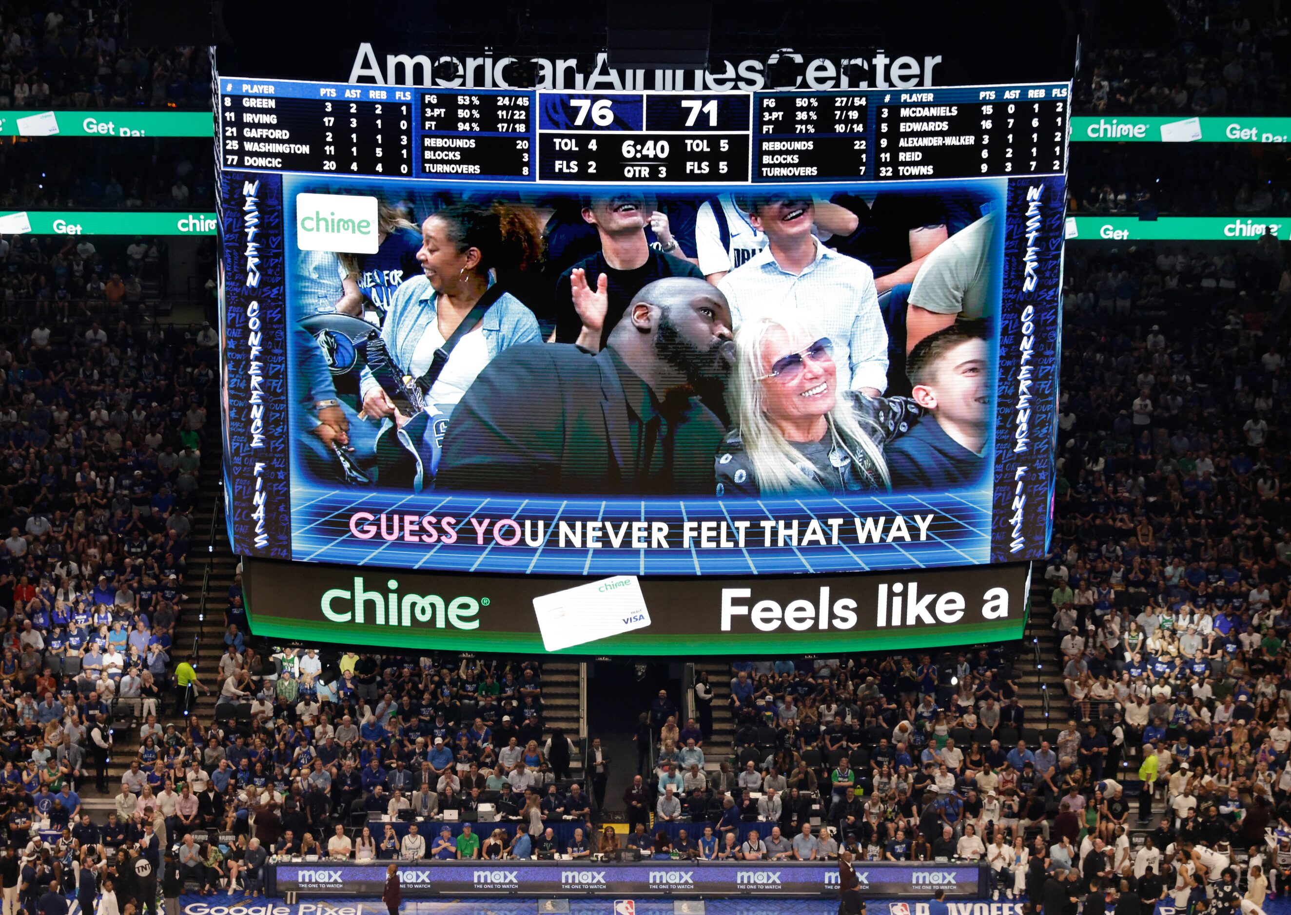 Shaq (left) serenades new Dallas Mavericks owner Miriam Adelson on the video board during a...