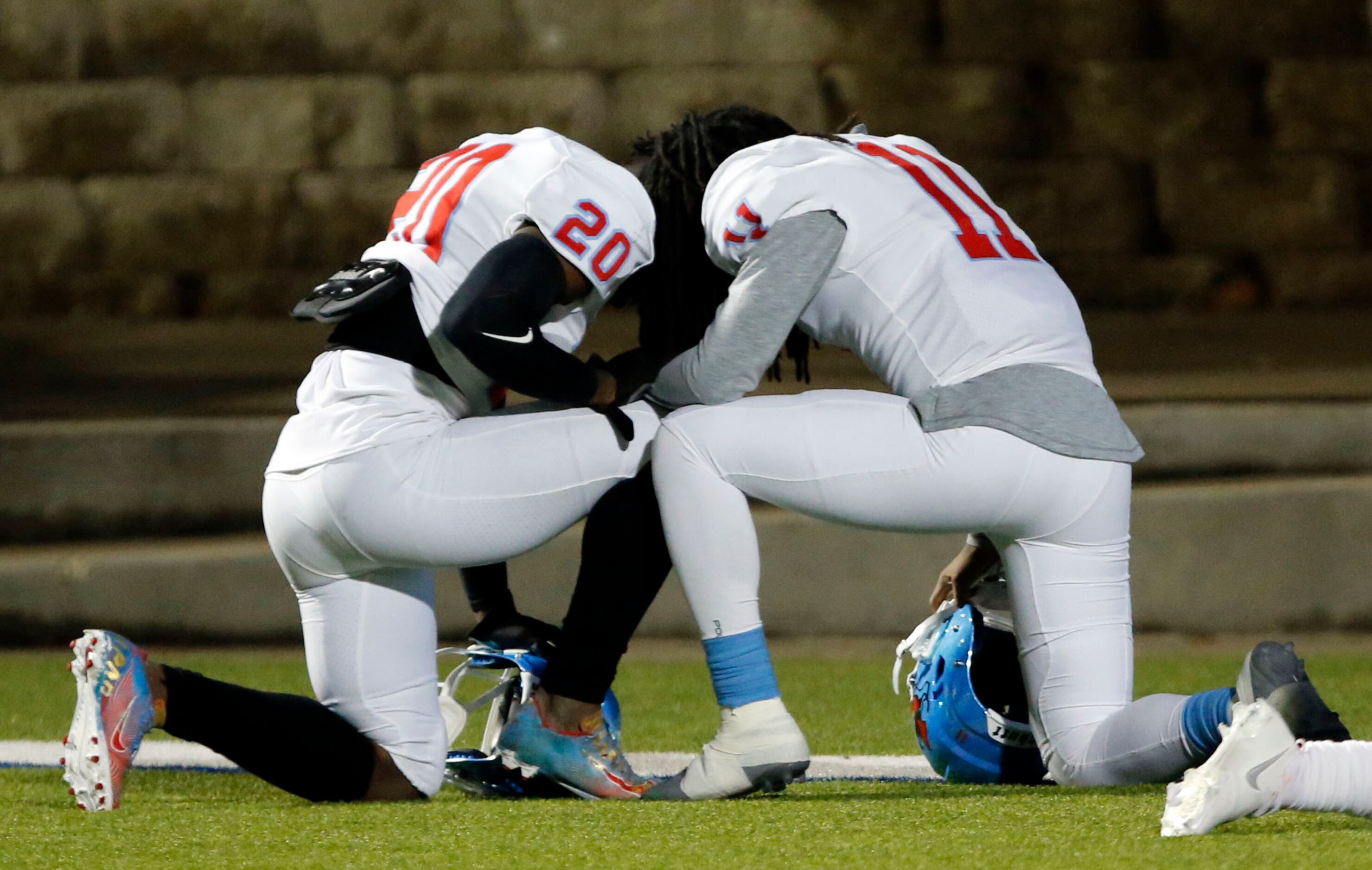 Skyline’s Gregory Johnson (20) and Quentin Moore (11) take a moment together before the...