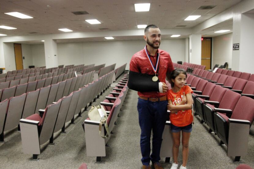 DIVERT graduate Stephan Chavez was joined by his sister, Gabriella Uresti, 7, after the July...