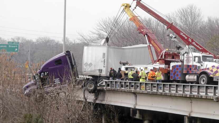 
The big rig budged off the rail as crews continued to work on the precarious situation...