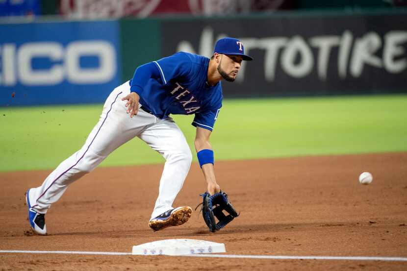 Texas Rangers third baseman Isiah Kiner-Falefa fields a grounder by Houston Astros' Max...
