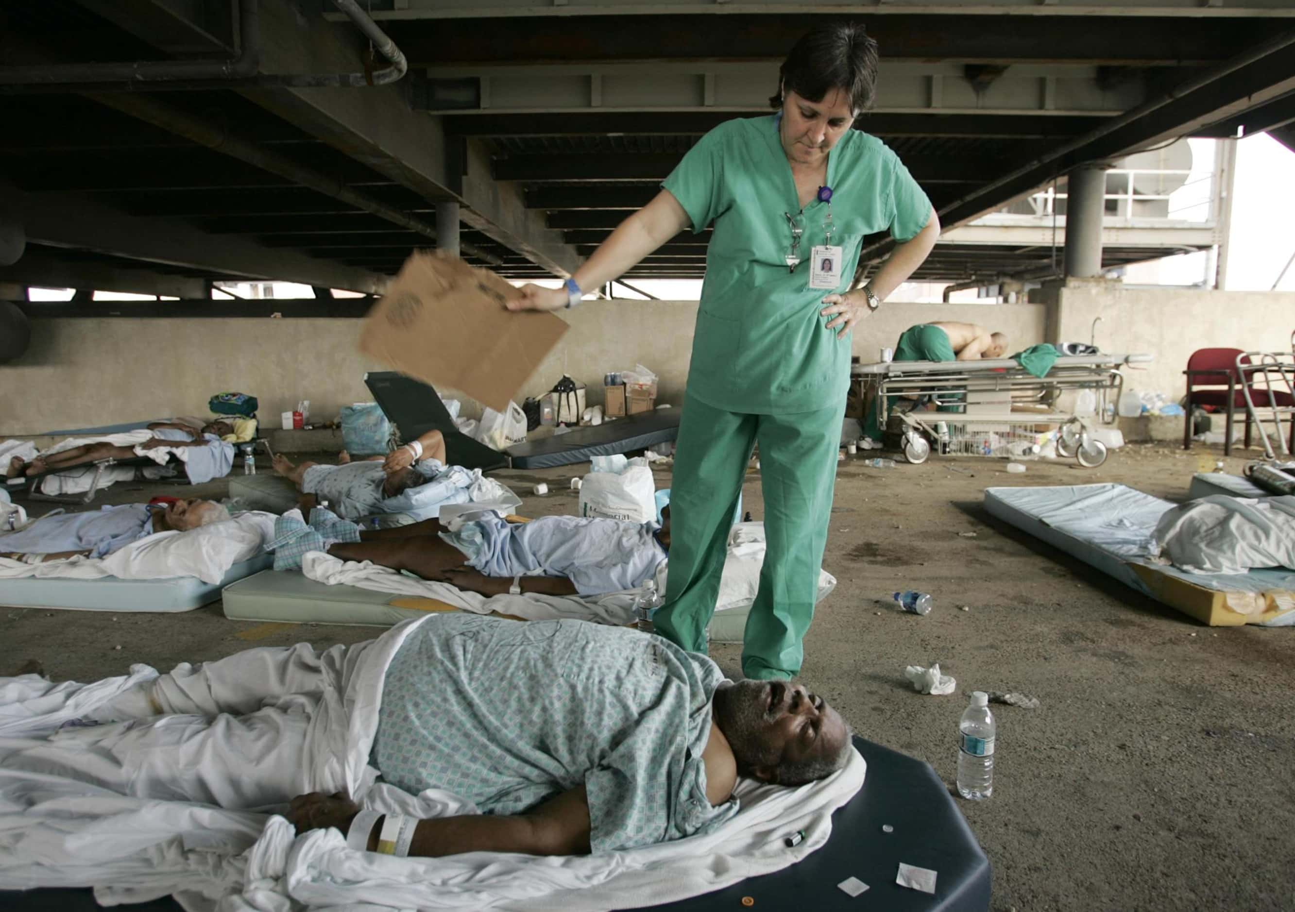 Memorial Medical Center nurse Mary Jo D'Amico fanned a patient waiting in the hospital's...