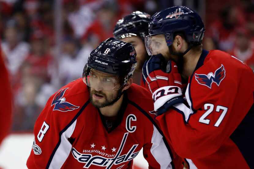 Washington Capitals left wing Alex Ovechkin (8), from Russia, listens to Washington Capitals...