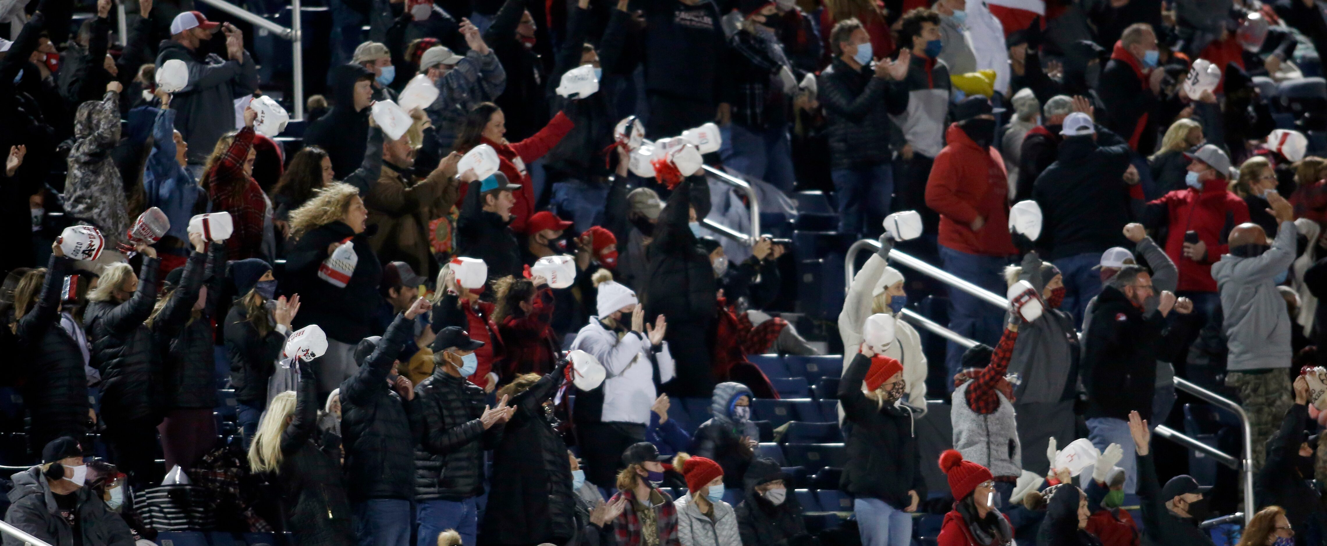 An energetic group pf Argyle fans react to a fumble recovery by the Eagles defense during...