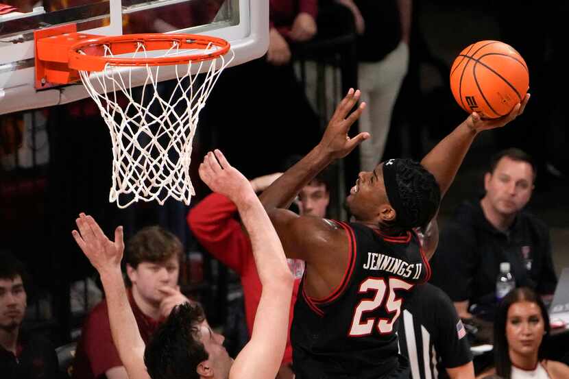Texas Tech forward Robert Jennings drives the ball to the basket in the second half against...
