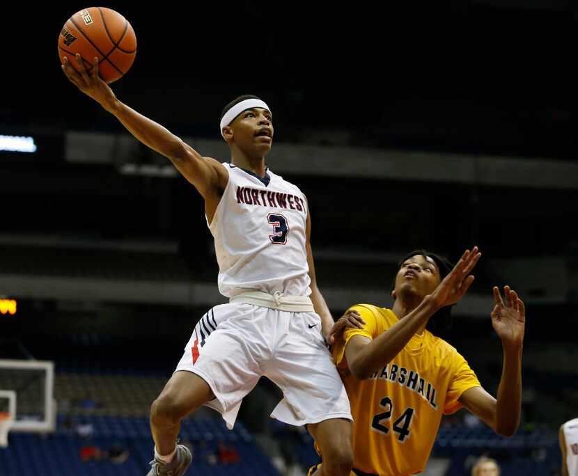 Justin Northwest's Avery Anderson (3) scores past Fort Bend Marshall's John Walker III (24)...