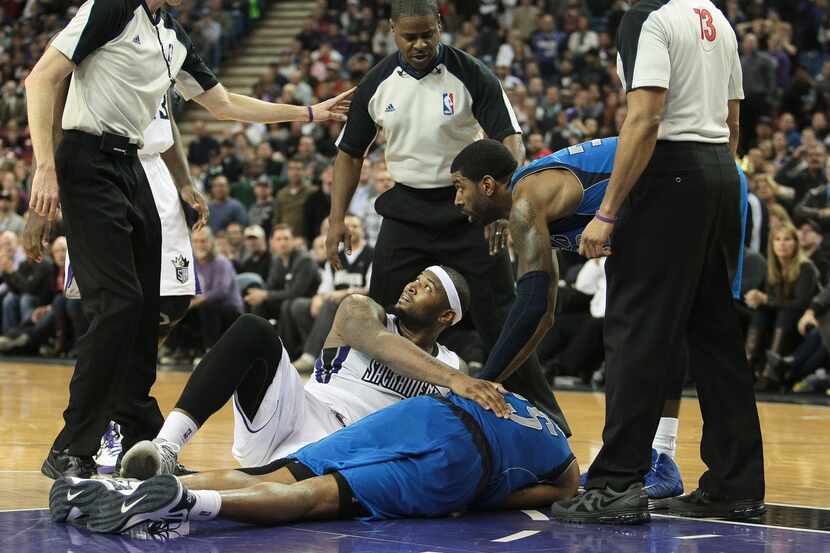 Jan 10, 2013; Sacramento, CA, USA; Referees determine a flagrant 2 foul by Sacramento Kings...