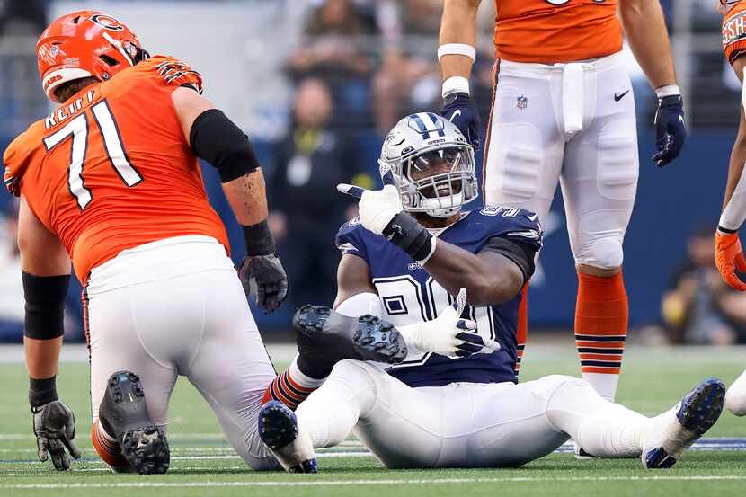 Dallas Cowboys defensive end DeMarcus Lawrence (90) points to Chicago Bears offensive tackle...